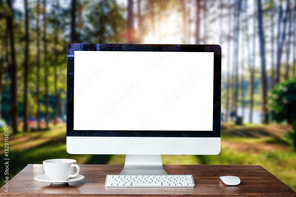 Computer Monitor, Keyboard,coffee cup and Mouse with Blank or White Screen Isolated is on the work t