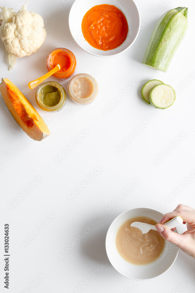 cooking vegetable puree for baby on white background top view