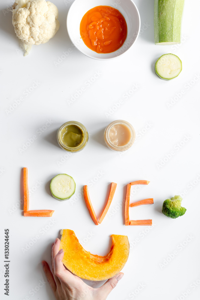 cooking vegetable puree for baby on white background top view