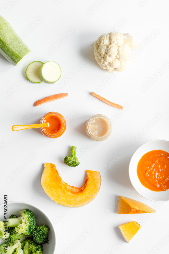 cooking vegetable puree for baby on white background top view