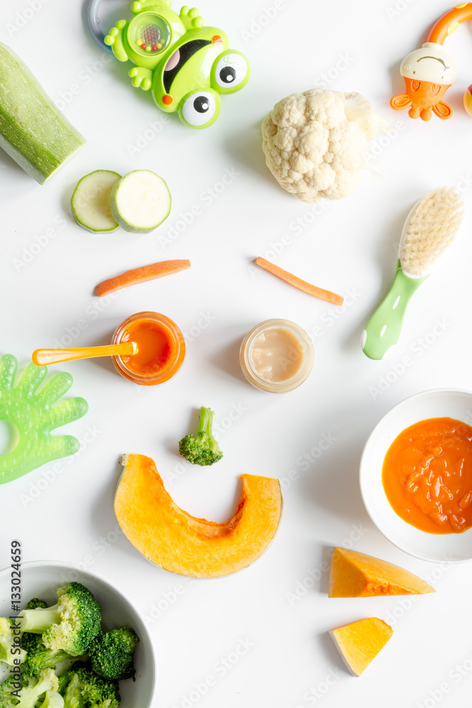 cooking vegetable puree for baby on white background top view