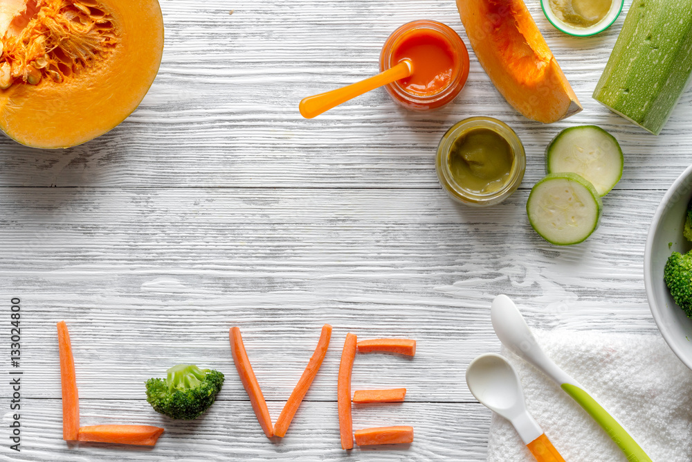 baby vegetable puree on wooden background top view