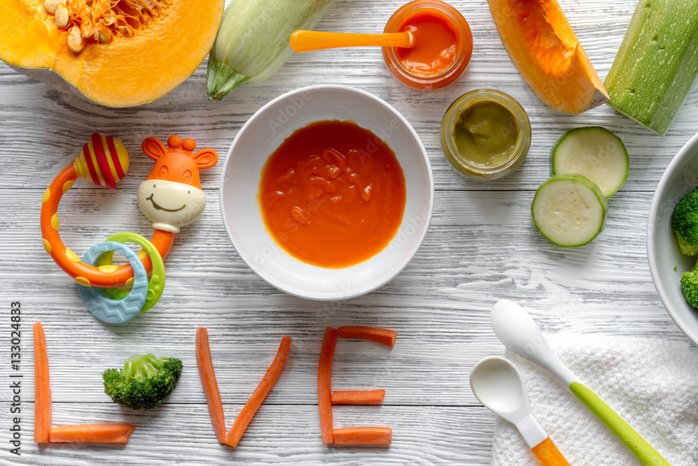 baby vegetable puree on wooden background top view