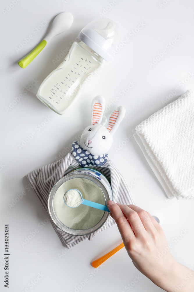 preparation of mixture baby feeding on white background top view