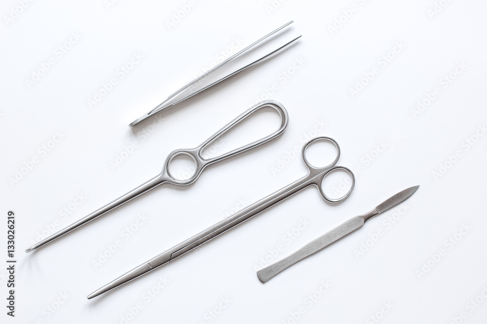 instruments for plastic surgery on white background top view