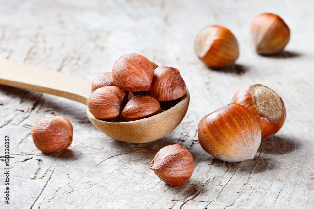 Hazelnut. Fresh organic filbert on wooden background. Nuts macro