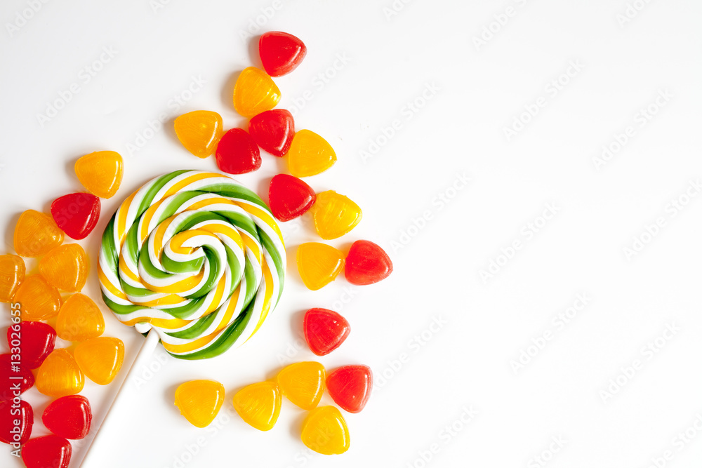 sweets and sugar candies on white background top view