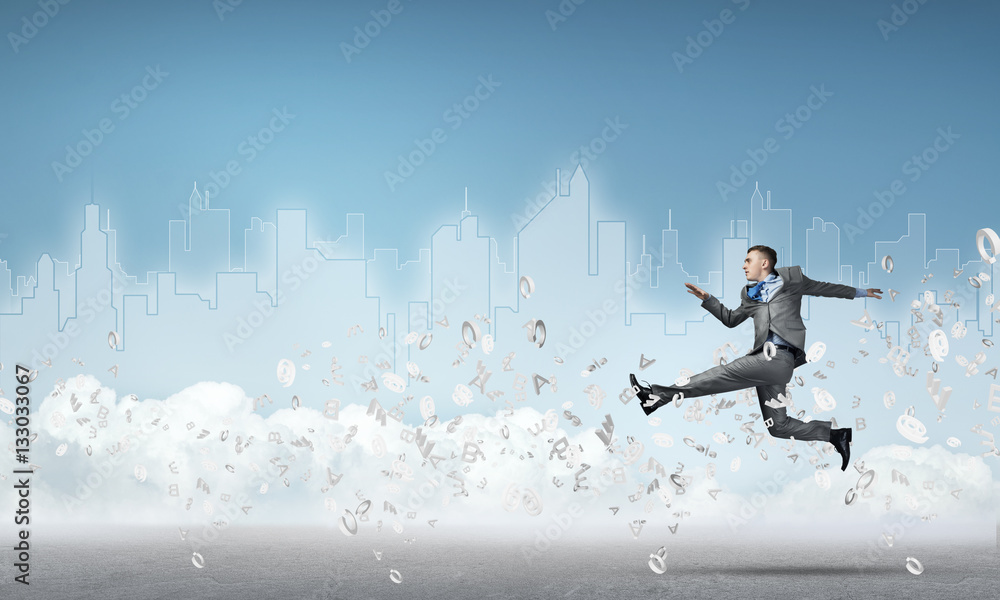 Businessman jumping high