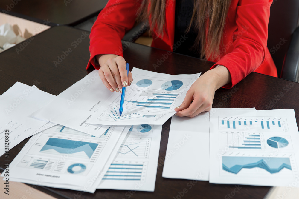 Businesswoman hand working with business graph or analysis chart. Close up business team analysis an