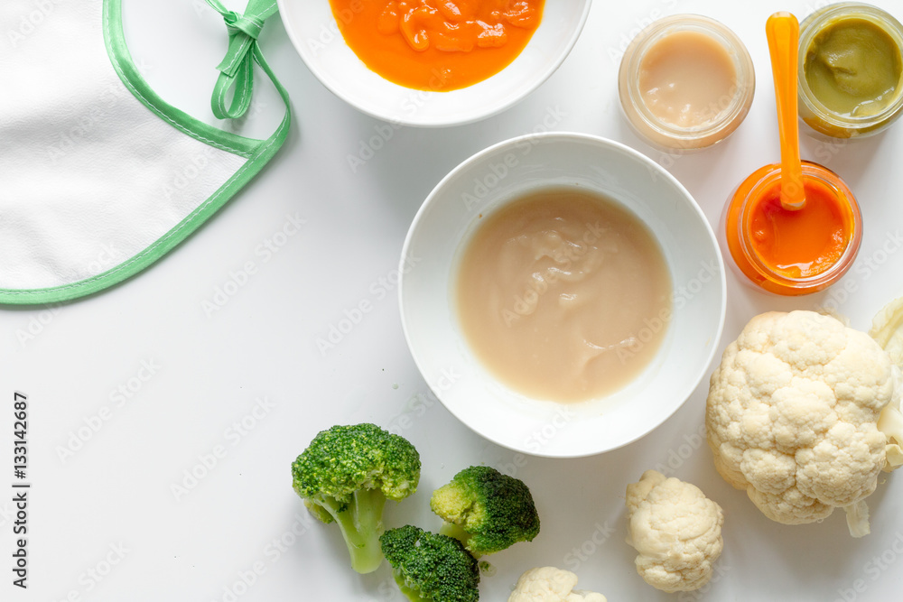 cooking vegetable puree for baby on white background top view