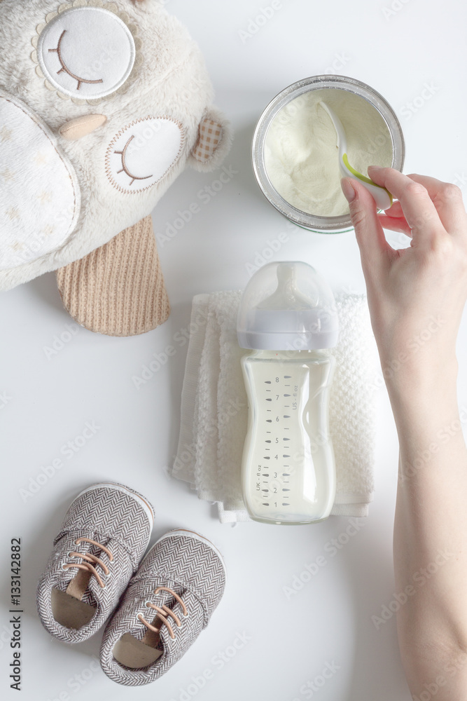 preparation of mixture baby feeding on white background top view