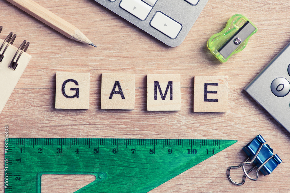 Elements of education game spelling words on wooden office table