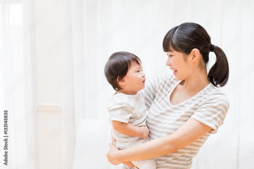 portrait of asian baby and mother relaxing