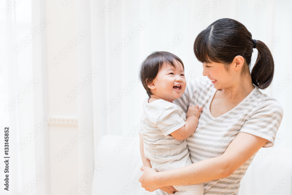 portrait of asian baby and mother relaxing