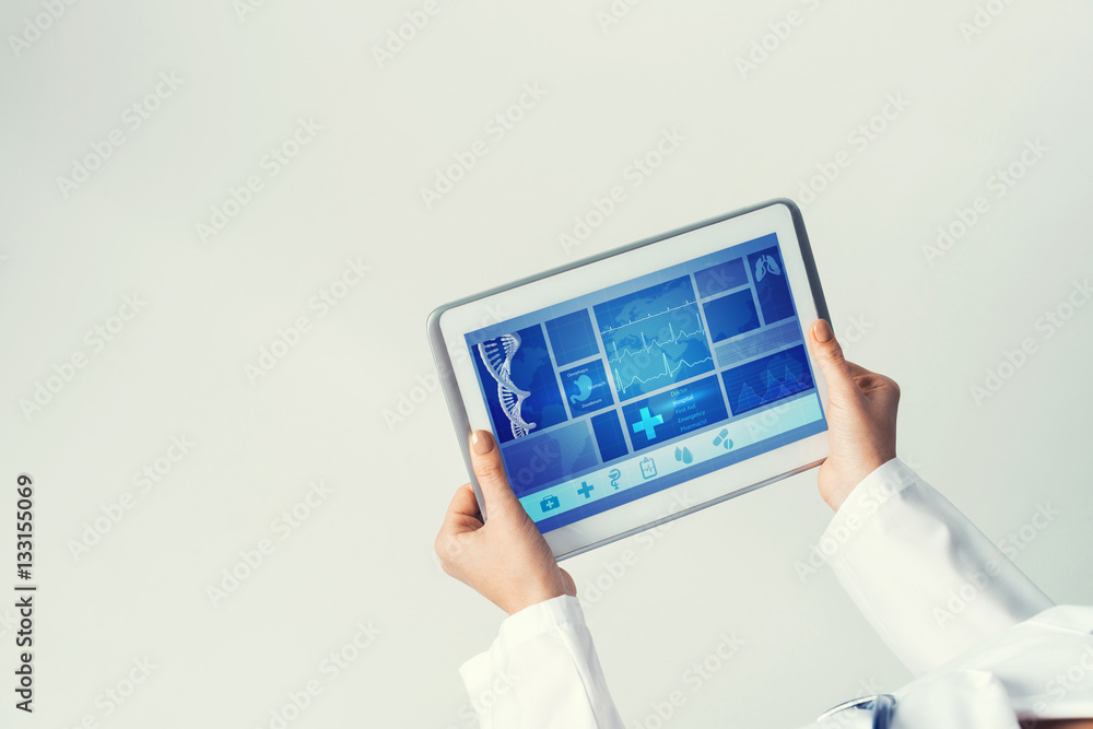 Close of female doctor hands working with tablet pc computer