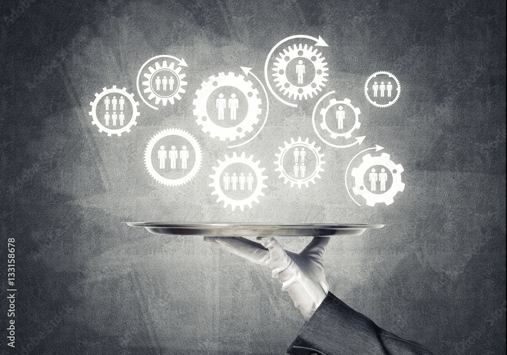 Waiter hand with white gloves holding silver plate full of social media communication icons