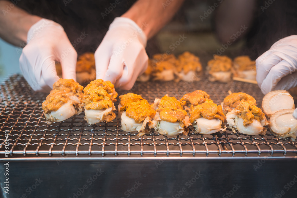 Scallop and sea eggs skewer grill