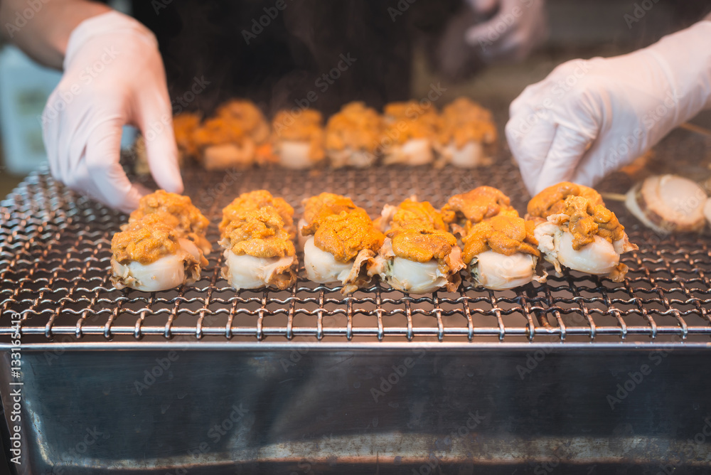 Scallop and sea eggs skewer grill