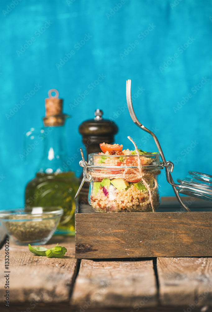 Healthy homemade jar quinoa salad with tomatoes, avocado and fresh basil. Detox, dieting, vegetarian