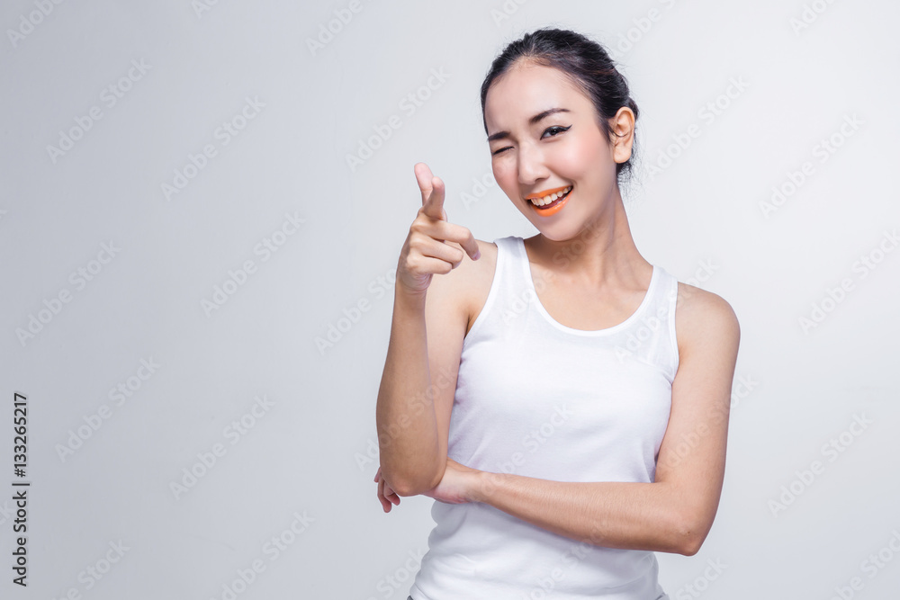 Beautiful young asian woman thinking on white background