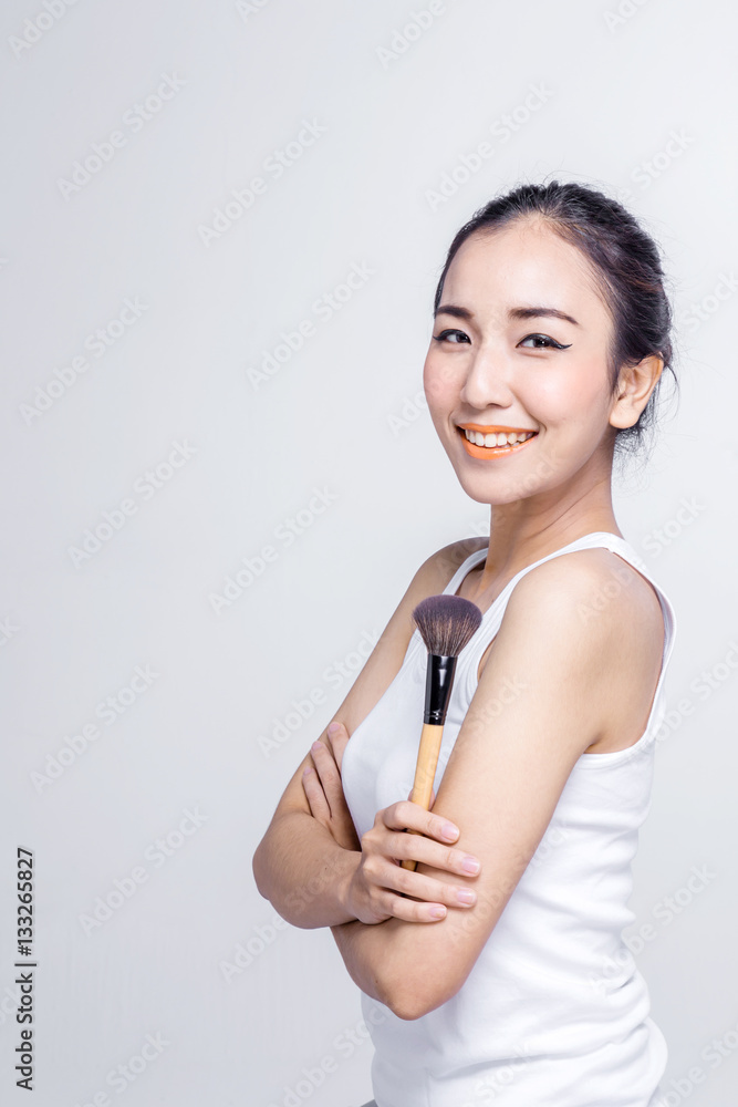 Beauty makeup asian woman smiling closeup. Beautiful young woman