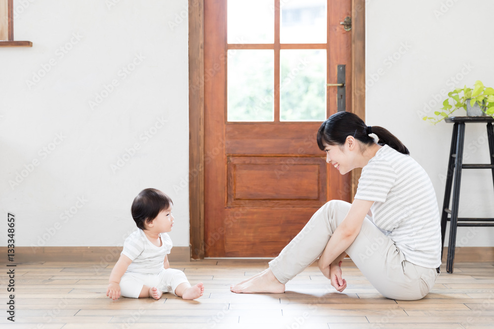 portrait of asian baby and mother relaxing