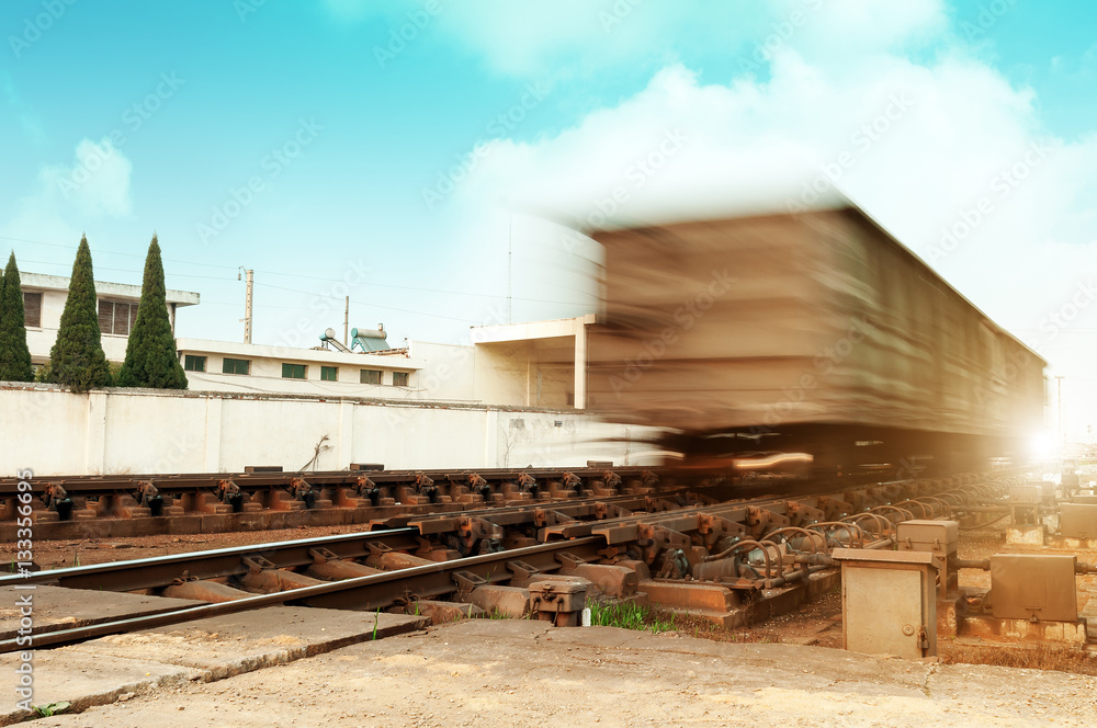 Dusk, fast moving Freight train.