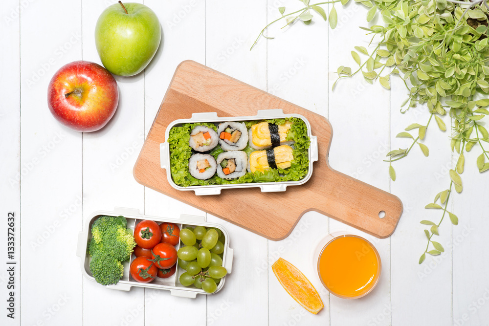 Bento box with different food, fresh veggies and fruits