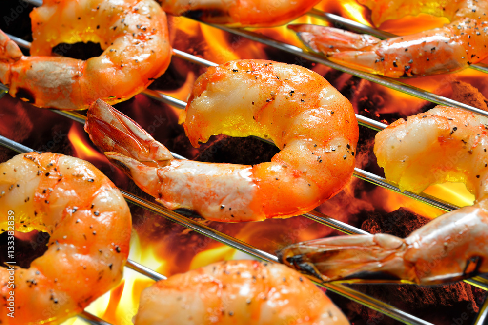 Grilled shrimps,prawns on the flaming grill