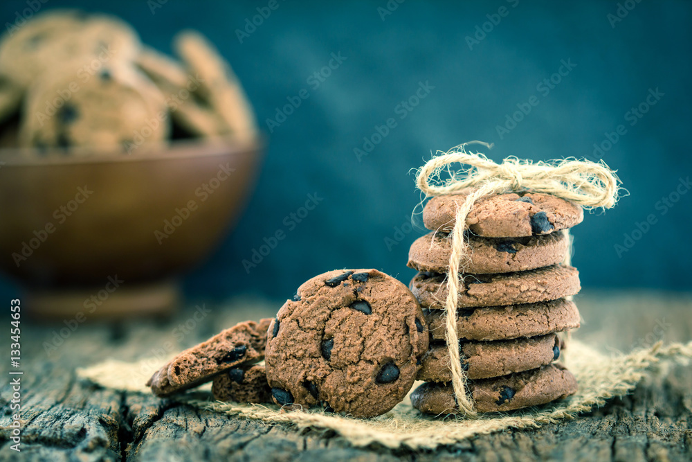 Still life of Close up stacked chocolate chip cookies on  napkin