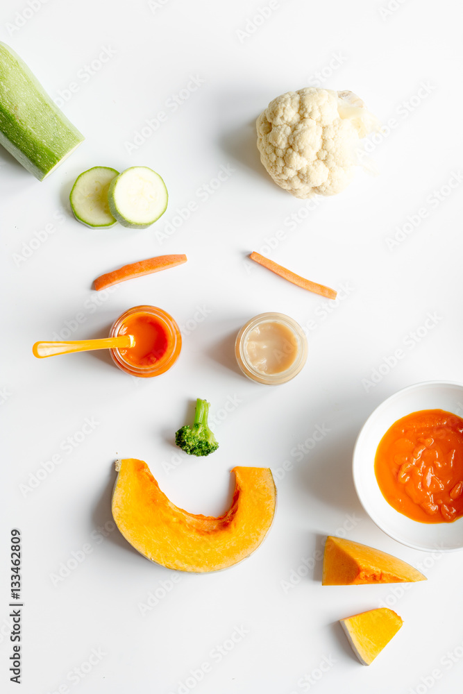 cooking vegetable puree for baby on white background top view