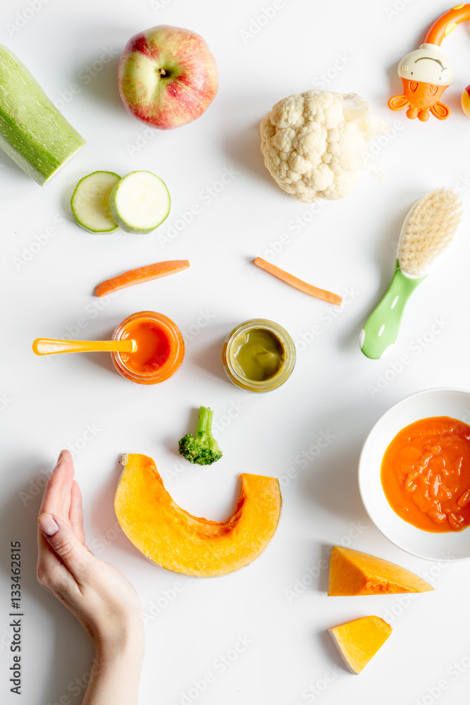 cooking vegetable puree for baby on white background top view