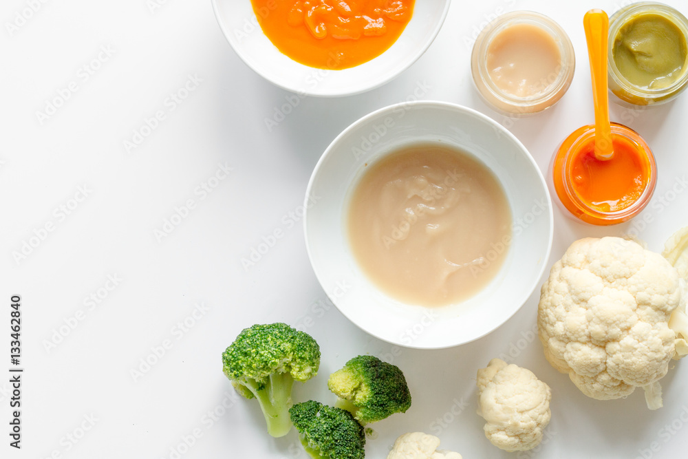 cooking vegetable puree for baby on white background top view