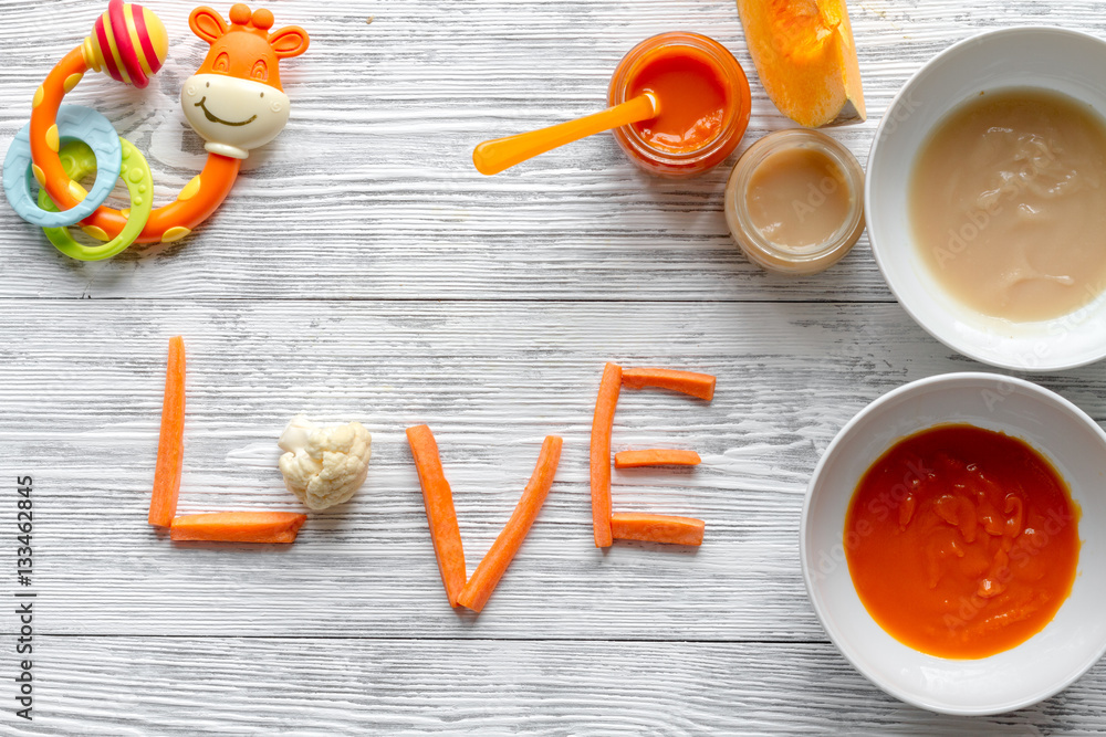 baby vegetable puree on wooden background top view