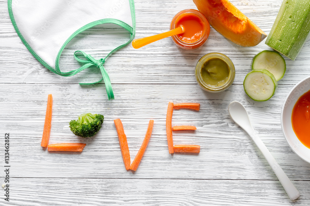 baby vegetable puree on wooden background top view