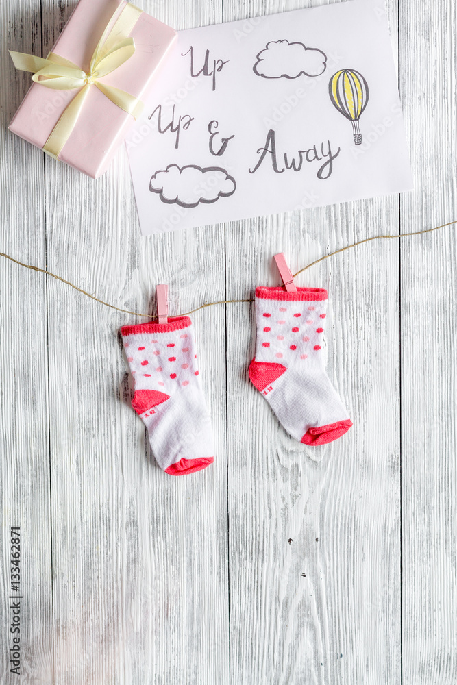 birth of girl - baby shower concept on wooden background