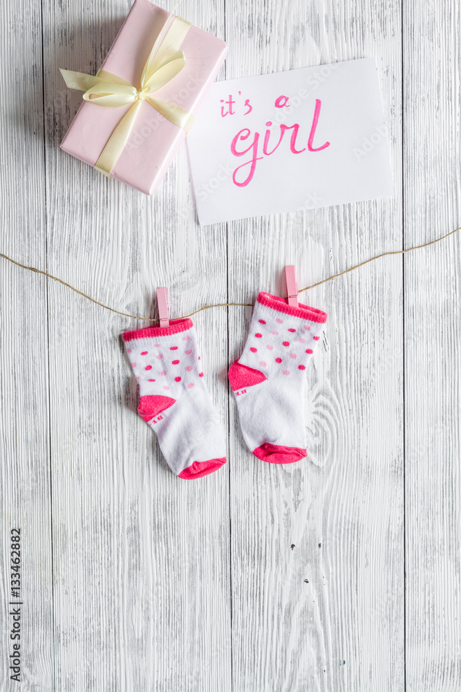 birth of girl - baby shower concept on wooden background