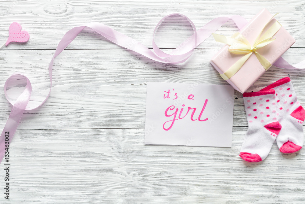 birth of girl - baby shower concept on wooden background