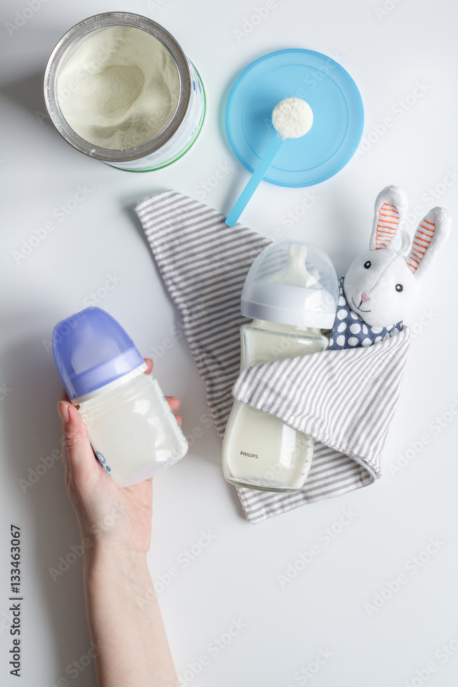 preparation of mixture baby feeding on white background top view