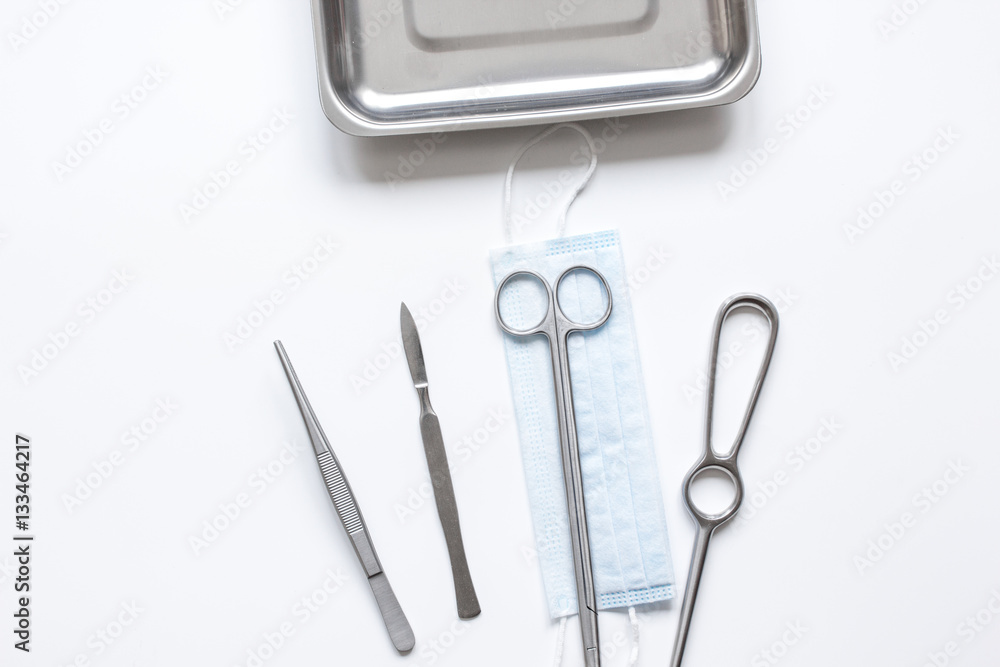 instruments for plastic surgery on white background top view