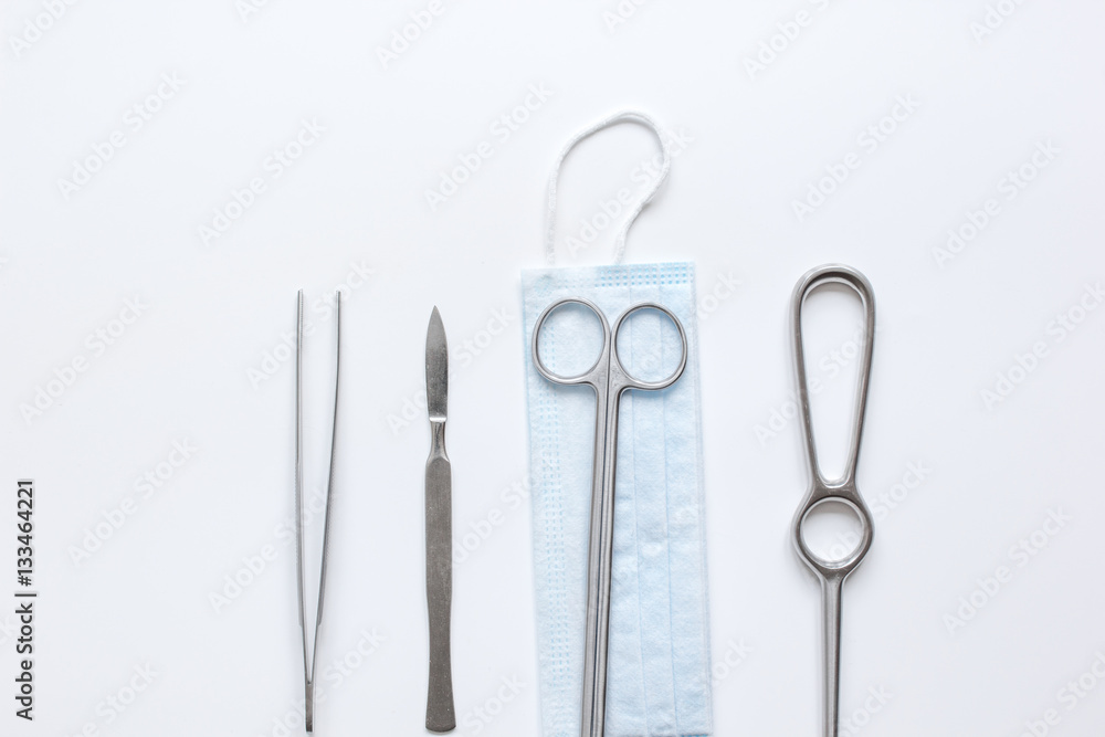 instruments for plastic surgery on white background top view