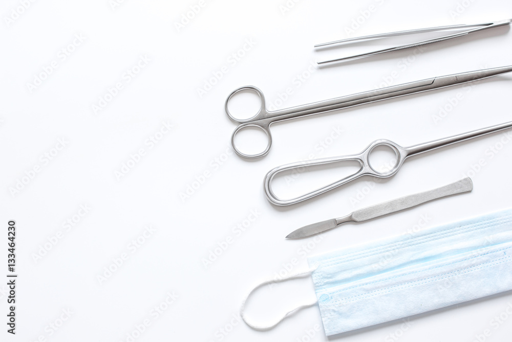 instruments for plastic surgery on white background top view