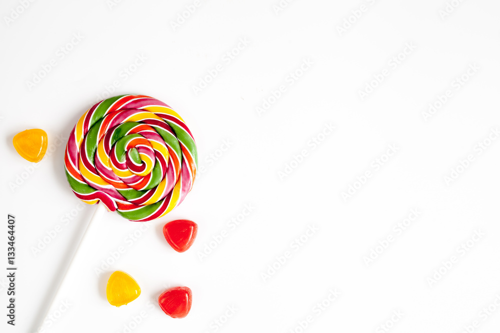 sweets and sugar candies on white background top view