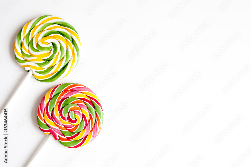 sweets and sugar candies on white background top view