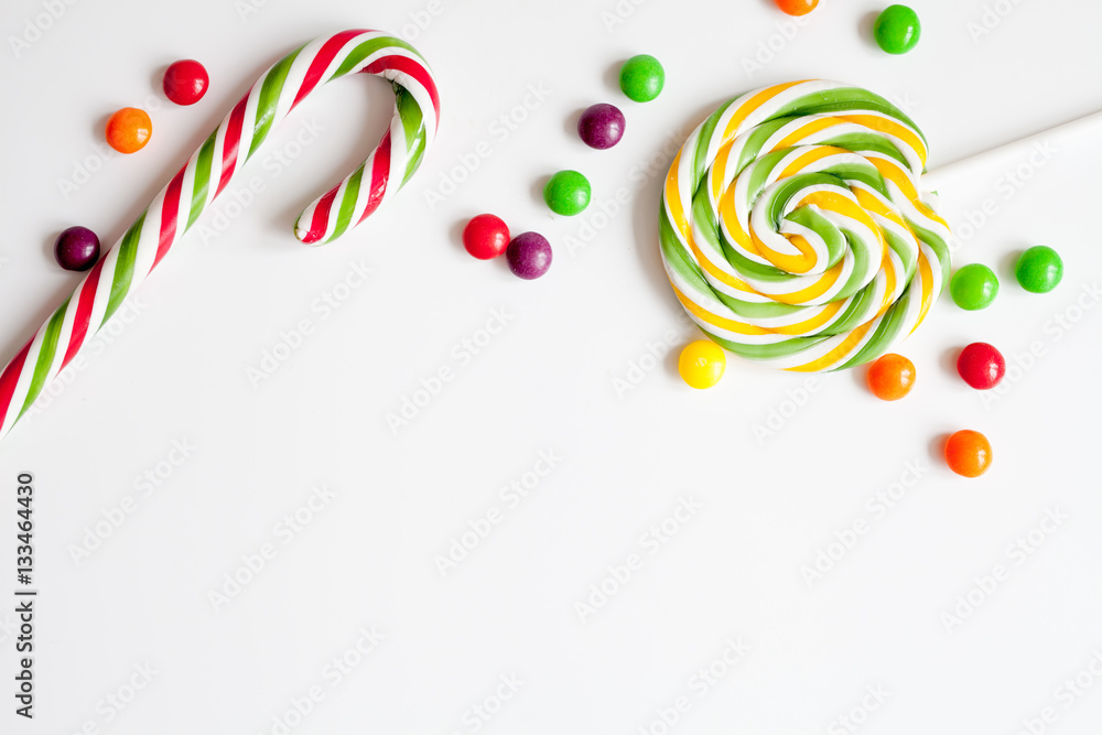 sweets and sugar candies on white background top view