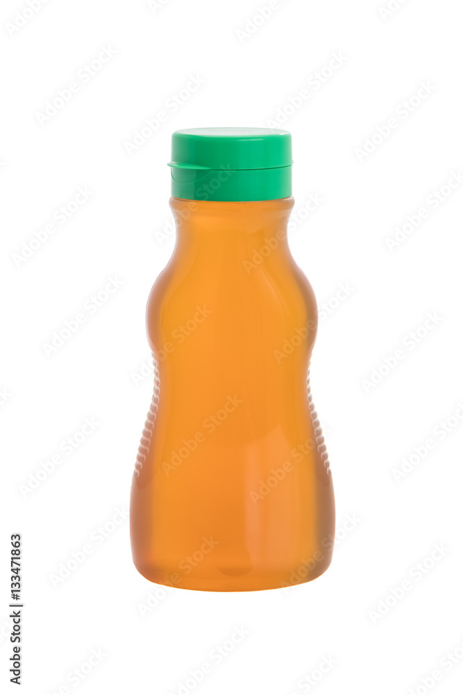 Nature pure honey in plastic bottle isolated on white background