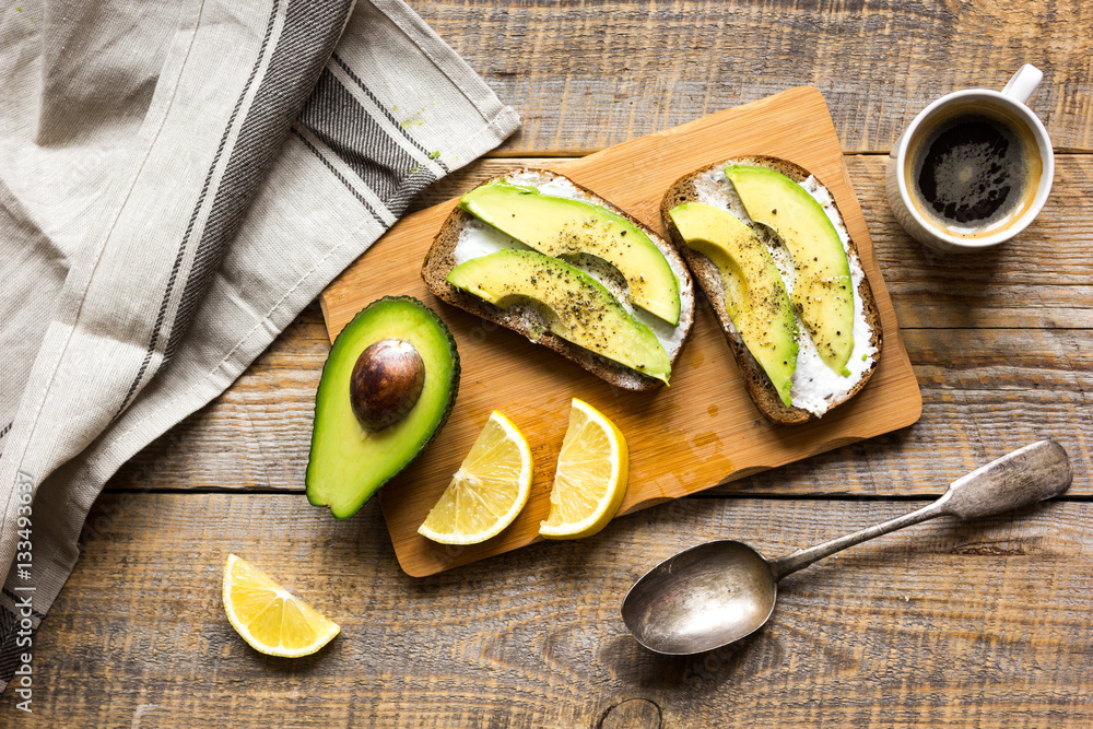 making sandwiches with avocado healthy organic food top view