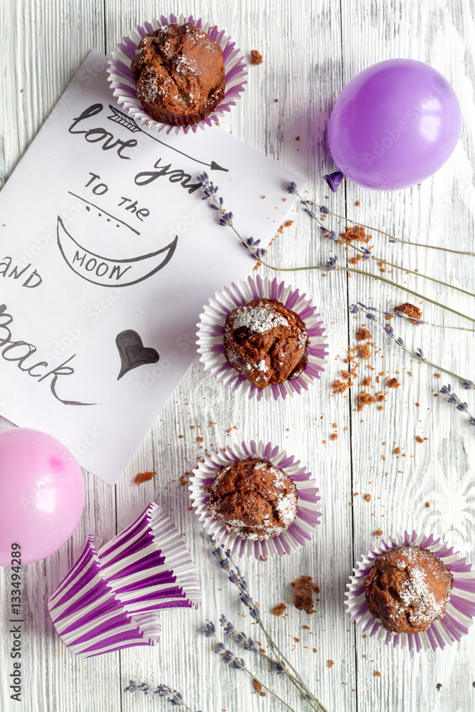 concept of Valentines Day cupcakes wooden background top view