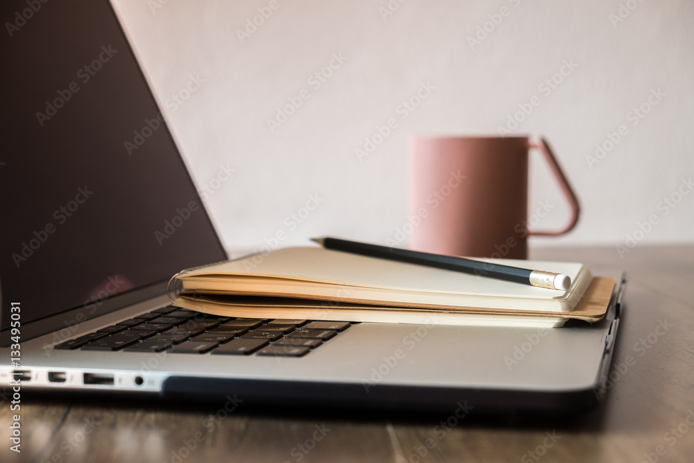 Working desk, Office and home office concept. with Laptop, Pencil, Milk cup on wooden table.