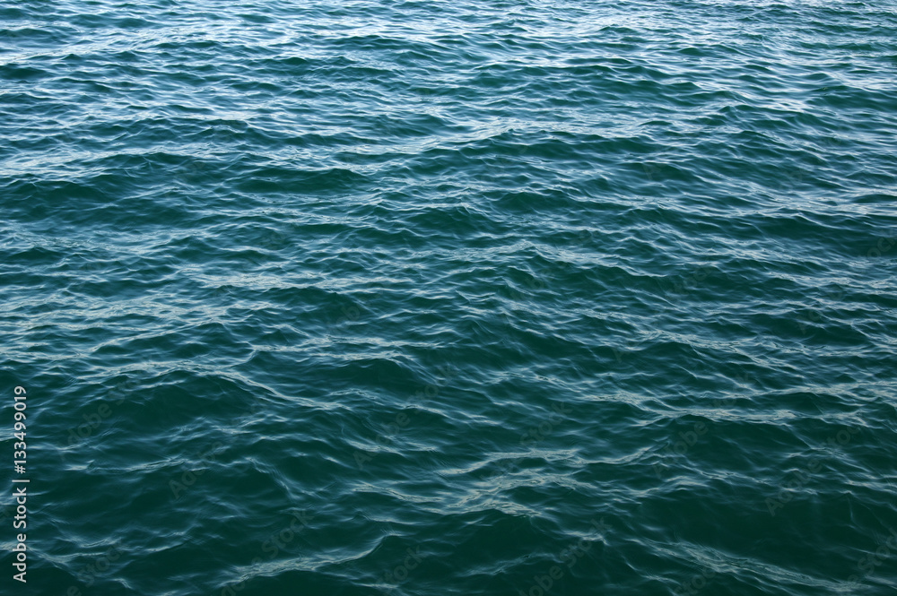 Blue sea surface with waves